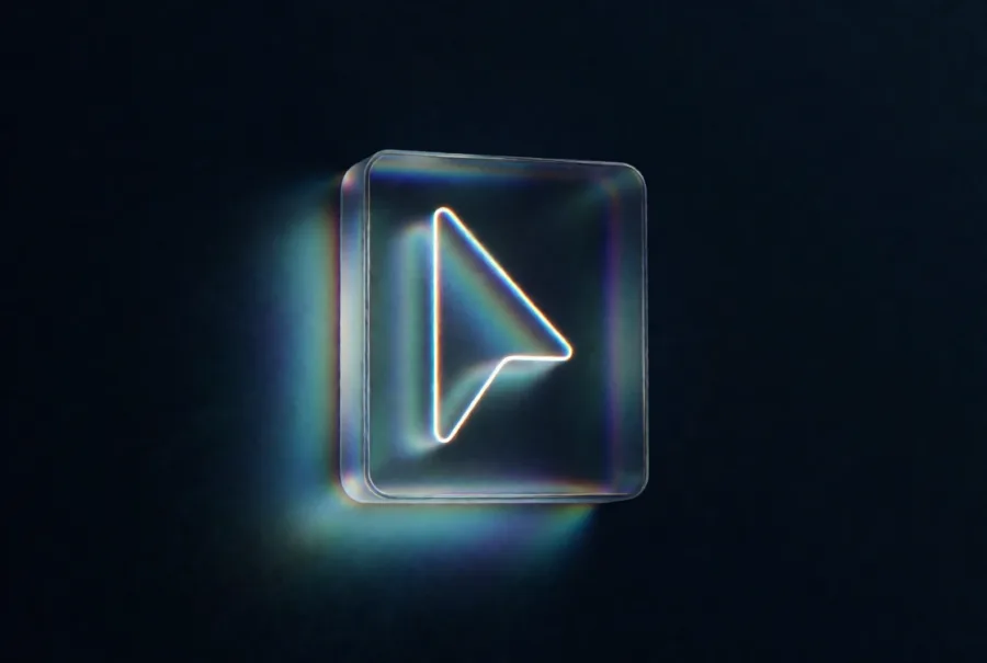 A glowing cursor outline set inside a frosted glass tile, throwing iridescent light onto the dark wall behind it